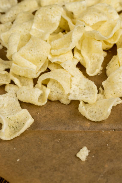 istock crispy potato chips with spices on the table 2006770008