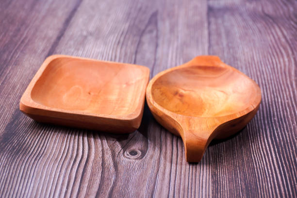 a dining place made of brown wood with various shapes on a wooden table