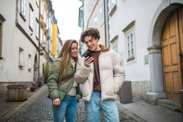 istock Cheerful Mother and Son Using Smartphone for Video Call Outdoors 2006775547