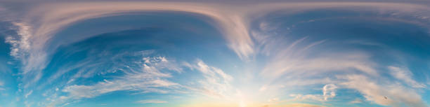 istock Sunset sky panorama, glowing pink Cirrus clouds, seamless 360 hdr equirectangular, great for virtual reality projects and sky replacement. Weather and climate change 2006788285