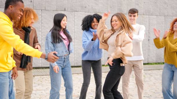 istock Multi-ethnic happy friends dancing excited in the city 2006849087