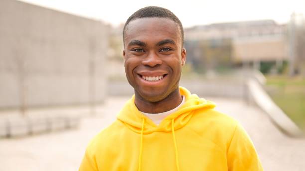 istock An african young man standing and smiling 2006850743