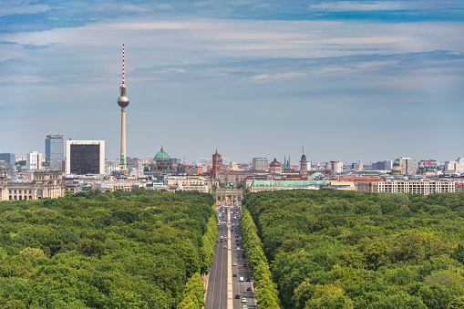 Berlin, Germany - June 30, 2018: Berlin cityscape view from a downtown bridge on Spree river, museum island with TV tower in the background.