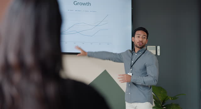 Presentation, computer and business man with statistics, data analytics or speaking of financial report in meeting or seminar. Senior manager and audience listening with graphs or charts on a screen