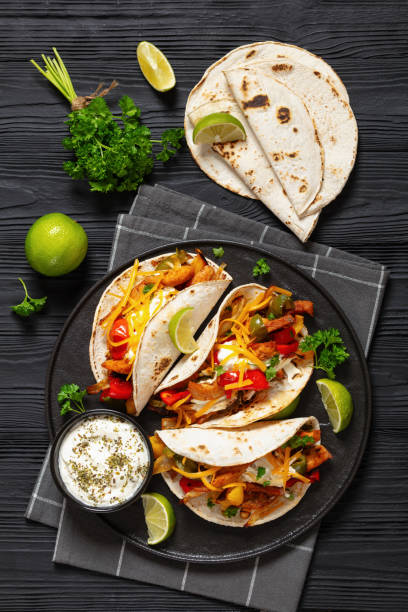 istock baked tex-mex chicken fajitas on a plate, top view 2006900064