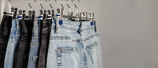 istock Jeans on a hanger. Modern, youth women's denim trousers. 2006919002