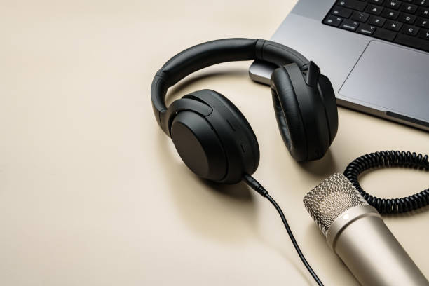 istock Headphones and microphone on the table close up 2006940256