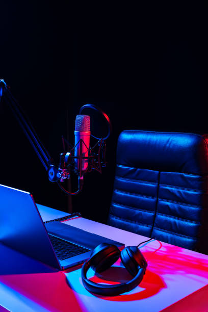 istock Home studio podcast interior. Microphone, table and chair 2006950374