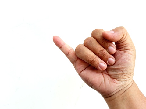 The little finger of a man's hand isolated on white background