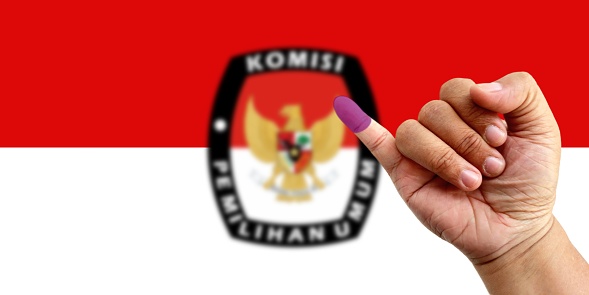 Bandung, Indonesia, February 13, 2024: Voting for the President of Indonesia for the period 2024 - 2029  with little finger