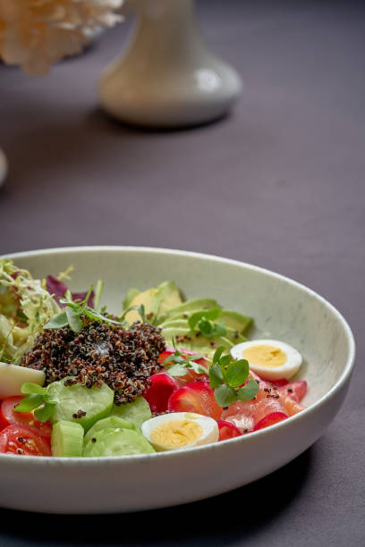 istock Bowl with salmon, quinoa and avocado on a blue background 2007003870