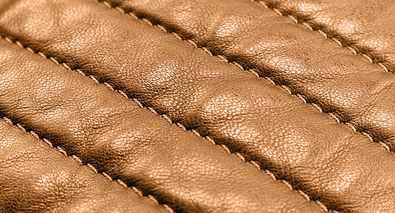 Macro shot leather texture background. Part of perforated brown leather details. Perforated leather texture background. Texture leather