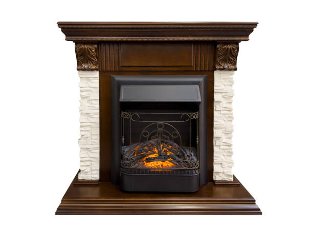 istock Dark wood burning fireplace isolated on white background. Stone burning fireplace.Luxury artificial electronic fireplace with firewoods isolated 2007032150