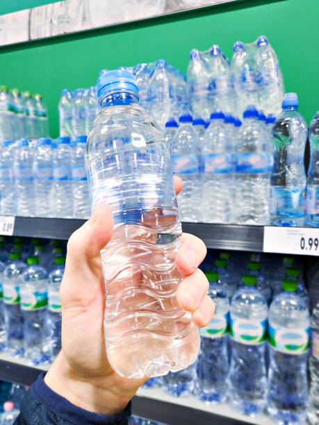 istock Drinking water in hand at shop 2007044887