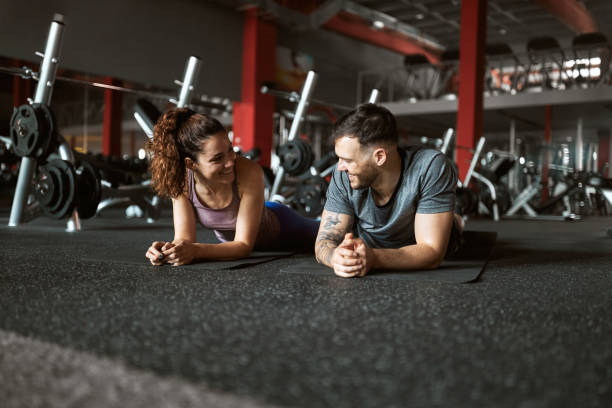 istock Happy athletic couple talking during a break in a gym. 2007062534