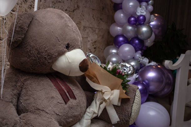 Balloon decoration with huge teddy bear and bouquet