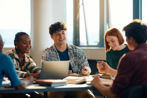 istock Multiracial group of happy students learning together at the university. 2007100439