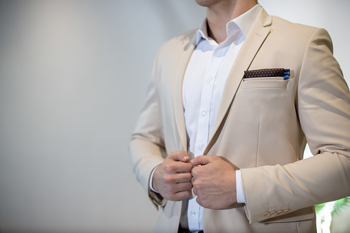 Unrecognizable businessman in formal clothes