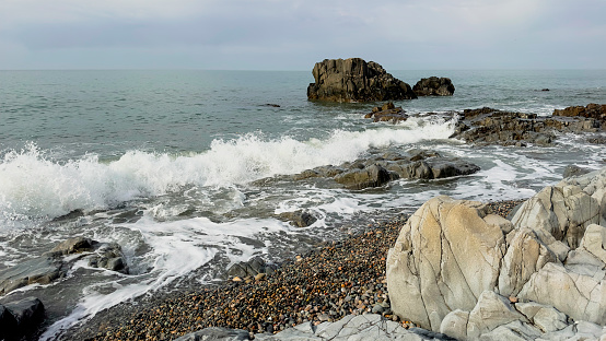 seascape with rocks and pebble beach