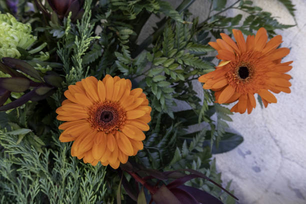 Detail of a nice bouquet of fresh flowers in a cemetery