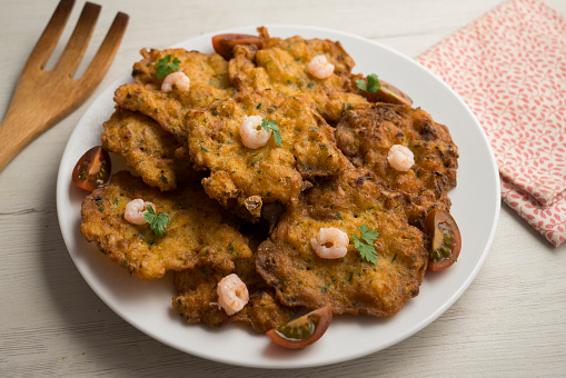 Tortitas de Camarones. Traditional tapa of flour and egg dough with shrimp or prawns, very famous in the Cadiz area in Spain..