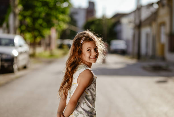 Beautiful girl dancing on the street.