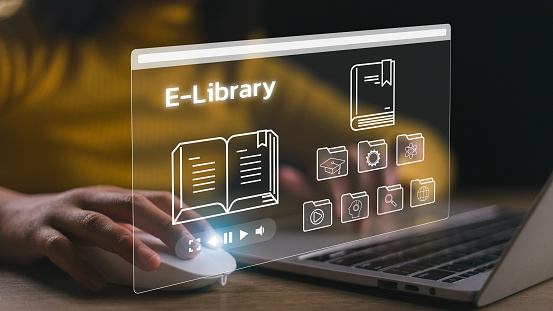 E-library concept. Women use a laptop with virtual Ebook icons for electronic books online, the knowledge base on the internet, digital library, or e-library.