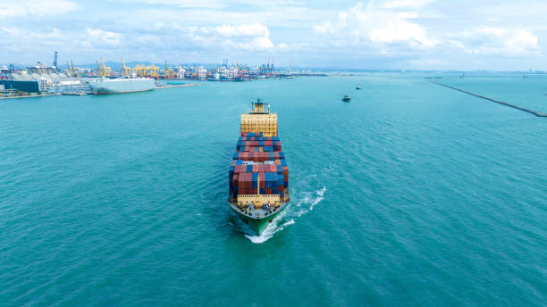 istock front view Cargo Container ship with contrail in the ocean ship carrying container and running for import export concept technology freight shipping by ship 2007157984