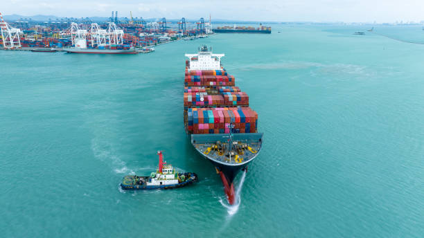 istock front view Cargo Container ship with contrail in the ocean ship carrying container and running for import export concept technology freight shipping by ship 2007158529
