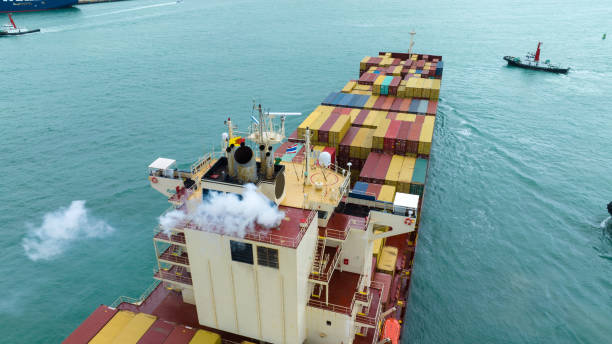 Smoke exhaust gas emissions carbondioxide from cargo lagre ship container ship,Marine diesel engine exhaust gas from combustion, Gas Emission Air Pollution from transportation. green house effect Eco Smoke exhaust gas emissions carbondioxide from cargo lagre ship container ship,Marine diesel engine exhaust gas from combustion, Gas Emission Air Pollution from transportation. green house effect Eco merchants gate stock pictures, royalty-free photos & images