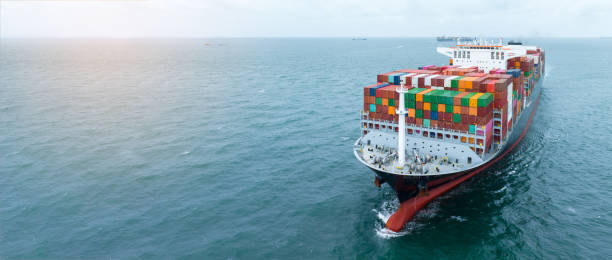 istock front view Cargo Container ship with contrail in the ocean ship carrying container and running for import export concept technology freight shipping by ship 2007163354