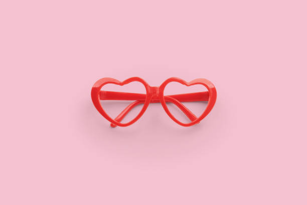 istock Red heart shaped sunglasses on pink background 2007224931