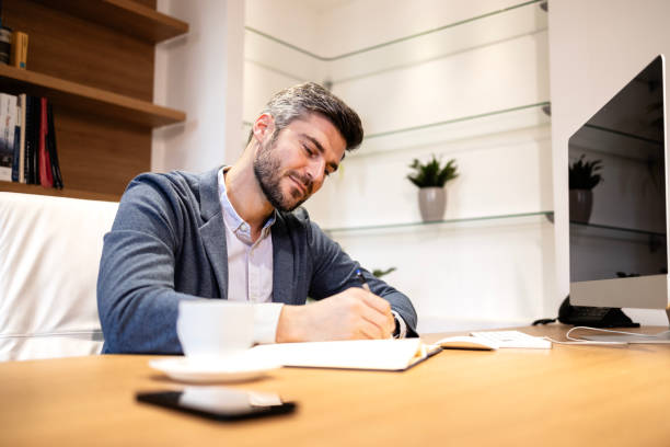 istock Positive smiling manager working in the office. 2007240369