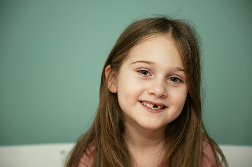 Seven year old girl lost baby tooth