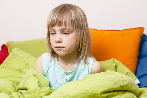 istock Girl with Chickenpox rash in bed 2007257497
