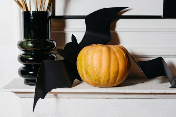 Halloween Decor with Pumpkin and Bat Silhouettes