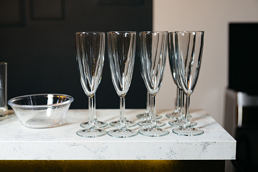 Elegant Empty Champagne Flutes on Marble Counter