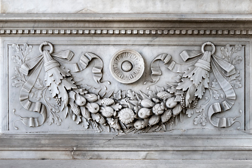 Verano cemetery, Rome, Italy: detail of Domenico D'Amico's grave who was artist and made his tomb. He died in 1901. In this photo, garland frieze with fruits and flowers.