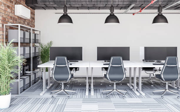 istock A cozy office interior with work desks in front of a white wall and copy space, a library with books and file folders on a brick wall, a potted plant 2007297265