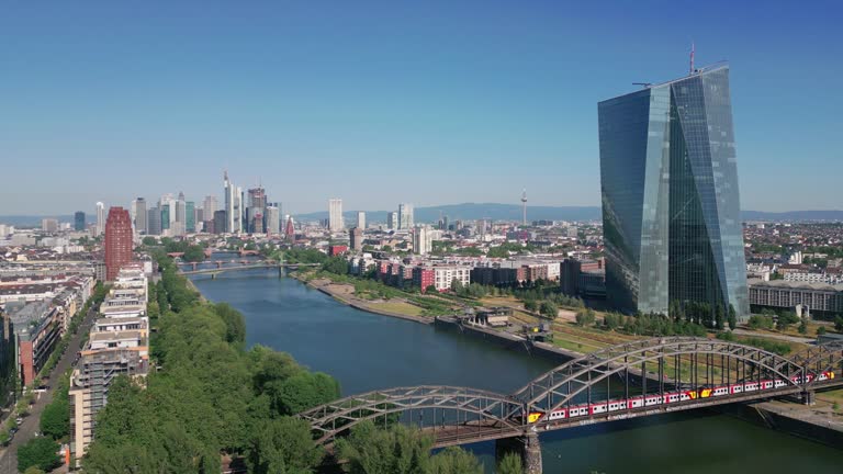 Aerial view of Frankfurt, showcasing the iconic EZB tower against a clear blue sky