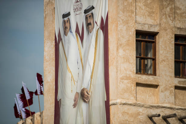 Hamad bin Khalifa al-Thani and Tamim bin Hamad Al Thani poster. Doha, Qatar - December 18,2017. Hamad bin Khalifa al-Thani and Tamim bin Hamad Al Thani posters on the occasion of Qatar National Day. qatar emir stock pictures, royalty-free photos & images