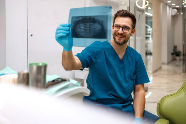 istock Dentist happily reviews x-ray Image 2007368829