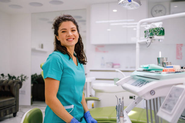 istock Smiling nurse in dental office 2007370988