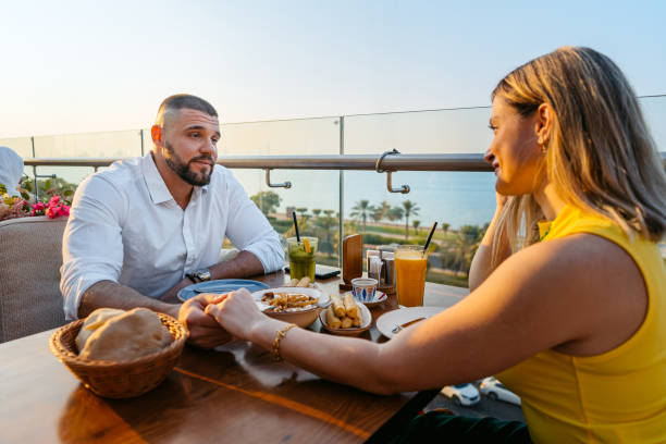 istock Young Couple Having Lunch In A Restaurant In Kuwait City 2007374834