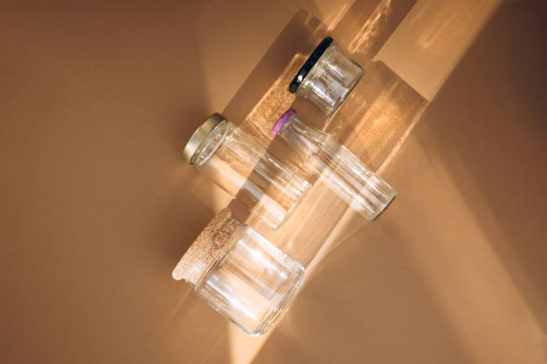 istock Set of eco friendly devices. Zero waste concept. Different size transparent jars in daylight with reflections 2007438223
