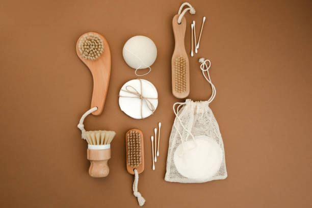 istock Set eco friendly bath devices. Washcloths and face sponge, ear sticks and bamboo toothbrushes on a brown background 2007438231