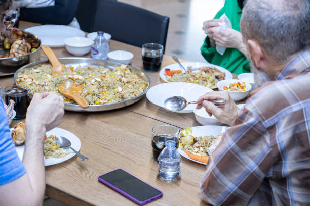 istock multi generation family eating together with grandfather 2007441460