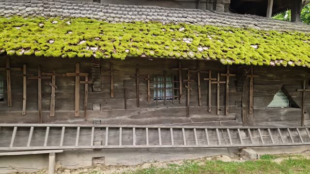 Fragment of side wall and roof of wooden medieval church