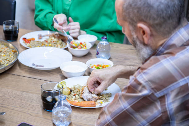 istock multi generation family eating together with grandfather 2007453221