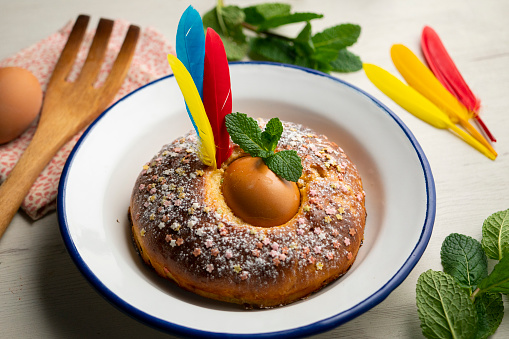 Mona de Pascua, sponge cake with boiled egg. Traditional Spanish dessert for Holy Week.